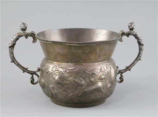 A large 19th century 17th century style two handled silver porringer 17.5 oz.